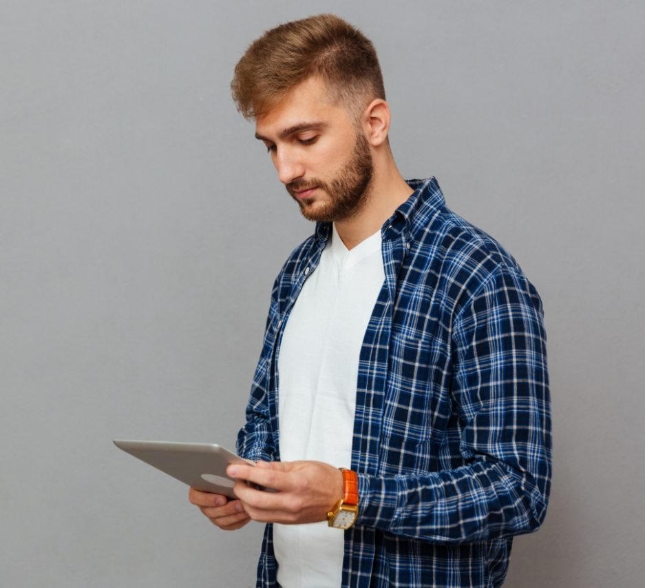 demo-attachment-16-portrait-of-a-man-using-tablet-computer-PCDLD3R